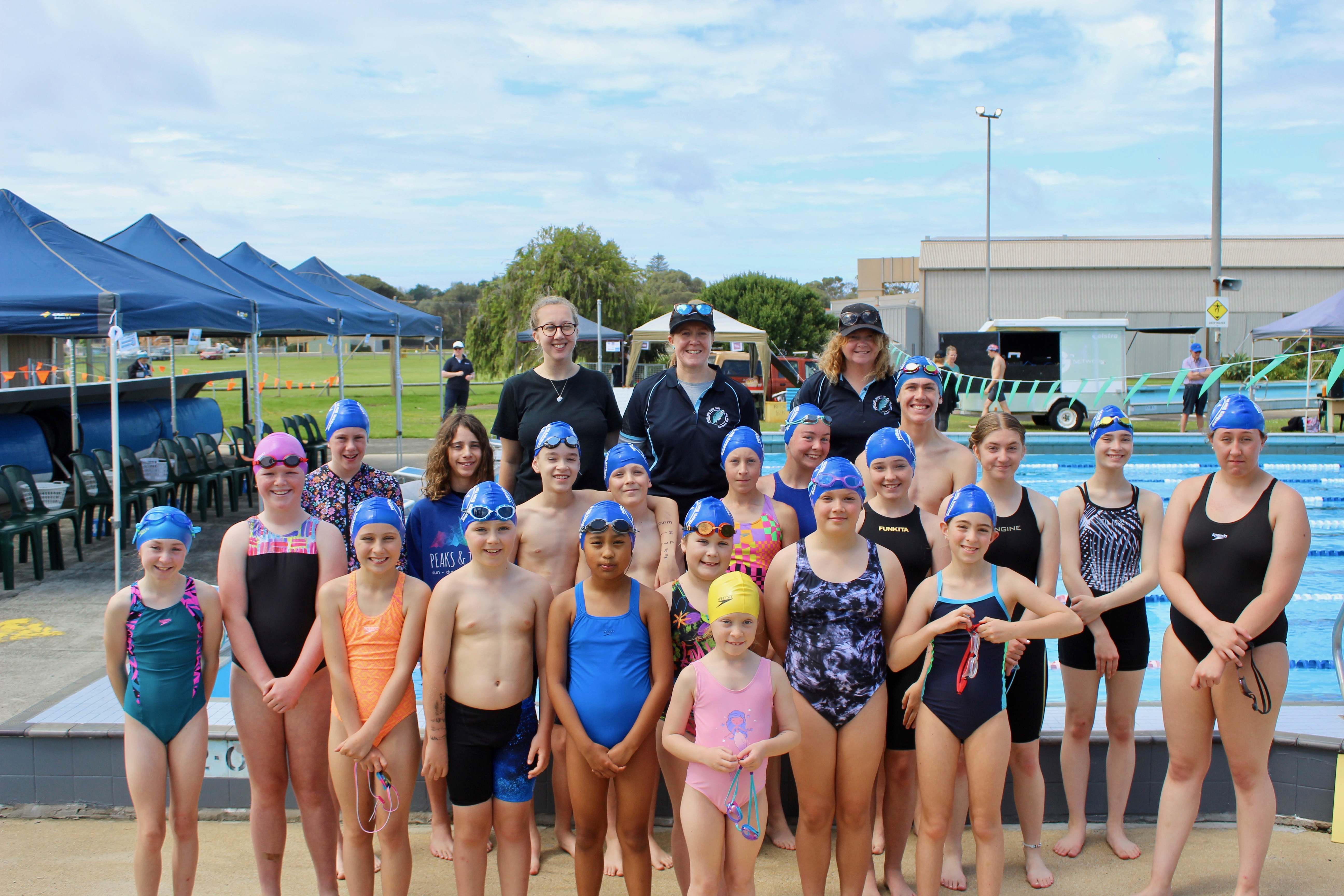 Some of the Portland Swimming Club kids with proud Coaches Kayla, Claire and Kristy